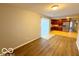 Cozy dining area with modern floors, adjacent to a well-equipped kitchen, perfect for Gathering meals and gatherings at 3656 Allison Ave, Indianapolis, IN 46224