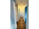 Long hallway features wood floors and white doors at 3656 Allison Ave, Indianapolis, IN 46224