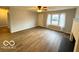 Spacious living room offers a decorative fireplace, modern floors, and ample natural light from a large window at 3656 Allison Ave, Indianapolis, IN 46224
