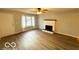 Bright living room features a decorative fireplace, sleek floors, and neutral paint, creating a serene atmosphere at 3656 Allison Ave, Indianapolis, IN 46224