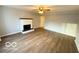 Bright living room features a decorative fireplace, sleek floors, and neutral paint, creating a serene atmosphere at 3656 Allison Ave, Indianapolis, IN 46224