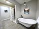 Elegant bathroom featuring a freestanding tub, a separate shower, and modern fixtures at 498 Johnson Ave, Franklin, IN 46131