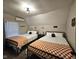 Shared bedroom featuring twin beds with orange patterned blankets at 498 Johnson Ave, Franklin, IN 46131