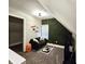 Cozy bedroom featuring a black couch and decorative green accent wall at 498 Johnson Ave, Franklin, IN 46131