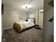 Inviting bedroom featuring a stylish bed frame, soft lighting, and cozy carpets at 498 Johnson Ave, Franklin, IN 46131