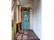 Inviting entrance with a wooden porch and a stylish blue front door at 498 Johnson Ave, Franklin, IN 46131