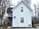 Charming home featuring white siding, a cozy front porch, and well-maintained landscaping at 498 Johnson Ave, Franklin, IN 46131