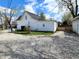 The exterior showcases a well-maintained backyard with ample space and a detached garage at 498 Johnson Ave, Franklin, IN 46131