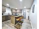 Spacious kitchen featuring an island with seating, modern cabinets, and sleek countertops at 498 Johnson Ave, Franklin, IN 46131