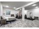 Spacious basement featuring durable floors, a modern gym, and bedroom area at 5650 Goodwin St, Indianapolis, IN 46234