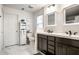 Bathroom with double sink vanity, cabinet, and tiled floor at 5650 Goodwin St, Indianapolis, IN 46234