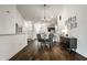 Bright open-concept dining area featuring modern lighting, dark wood floors, and an open layout at 5650 Goodwin St, Indianapolis, IN 46234