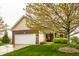 Attractive single-Gathering home with brick and siding exterior, a two-car garage, and a well-kept lawn at 5650 Goodwin St, Indianapolis, IN 46234