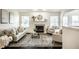 Comfortable living room featuring a fireplace, neutral tones, and natural light at 5650 Goodwin St, Indianapolis, IN 46234