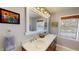 Bathroom featuring marble countertops, a double sink vanity, and modern fixtures at 717 Washington Ct, Anderson, IN 46011