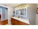 Spacious bathroom with double vanity, marble countertops, and modern lighting at 717 Washington Ct, Anderson, IN 46011