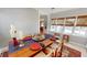 Cozy dining area with a wooden table set for a meal, and natural light from large windows at 717 Washington Ct, Anderson, IN 46011