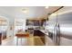 Well-lit kitchen with stainless steel appliances, dark cabinets, and a butcher block island at 717 Washington Ct, Anderson, IN 46011