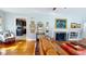 Bright living room with fireplace, hardwood floors, and stylish decor at 717 Washington Ct, Anderson, IN 46011