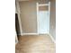Bedroom featuring laminate floors, a closet, and neutral walls at 834 N Temple Ave, Indianapolis, IN 46201