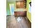 Kitchen featuring cabinets, a sink, backsplash, and tile flooring at 834 N Temple Ave, Indianapolis, IN 46201