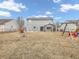 Large backyard featuring an outdoor pergola, play set, and lots of space at 878 Hollowood Ln, Avon, IN 46123