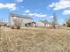 Backyard featuring a wooden pergola, playset, grass and exterior of home at 878 Hollowood Ln, Avon, IN 46123