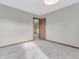 This bedroom features neutral walls, carpet flooring, and a door leading to another room at 878 Hollowood Ln, Avon, IN 46123