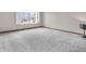 Neutral-colored bedroom featuring natural light from the window and plush carpet at 878 Hollowood Ln, Avon, IN 46123