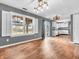 Dining room featuring wood floors and views of the backyard at 878 Hollowood Ln, Avon, IN 46123