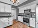 Modern kitchen featuring stainless steel appliances, updated cabinetry, and a convenient microwave at 878 Hollowood Ln, Avon, IN 46123