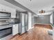 Open-concept kitchen that leads to a large living area with modern stainless steel appliances at 878 Hollowood Ln, Avon, IN 46123