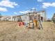 Backyard featuring a wooden play set with swings and a slide at 878 Hollowood Ln, Avon, IN 46123