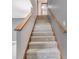 Carpeted staircase with wood handrail leading to the upper level of the home at 878 Hollowood Ln, Avon, IN 46123