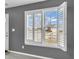 A bright window with white shutters offers a view to the outdoors at 878 Hollowood Ln, Avon, IN 46123