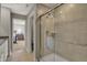Modern bathroom featuring a tiled walk-in shower and tile flooring at 8931 Alexander Ridge Dr, McCordsville, IN 46055