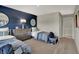 Stylish bedroom featuring a blue accent wall, two twin beds and carpet flooring at 8931 Alexander Ridge Dr, McCordsville, IN 46055