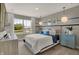 Inviting bedroom featuring large windows with scenic view, soft carpet flooring, and stylish decor at 8931 Alexander Ridge Dr, McCordsville, IN 46055