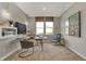 Cozy home office with natural light, a modern desk, bookshelves and comfortable seating area at 8931 Alexander Ridge Dr, McCordsville, IN 46055