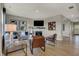 Inviting living room featuring modern decor, cozy seating, a stylish fireplace and natural light at 8931 Alexander Ridge Dr, McCordsville, IN 46055