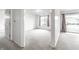 Bright bedroom features plush carpeting and a large window allowing for plenty of natural light at 9820 Legends Creek Dr # 103, Indianapolis, IN 46229