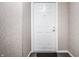 Interior shot of the front door, with white trim and gray patterned wall coverings at 9820 Legends Creek Dr # 103, Indianapolis, IN 46229