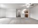 Open concept living room featuring neutral walls, carpet flooring, and a ceiling fan at 9820 Legends Creek Dr # 103, Indianapolis, IN 46229