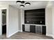 Entertainment area featuring a stylish bar with sleek cabinets, quartz countertops, and modern fixtures at 124 1St. Se Ave, Carmel, IN 46032