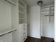 Walk-in closet with custom shelving and drawers for optimal storage at 124 1St. Se Ave, Carmel, IN 46032