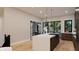Contemporary kitchen featuring marble countertop island, stainless steel appliances, and ample natural light at 124 1St. Se Ave, Carmel, IN 46032