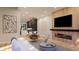 Bright living room featuring hardwood floors, a modern fireplace, stylish furniture, and an open-concept design at 124 1St. Se Ave, Carmel, IN 46032