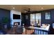 Relaxing outdoor space with a fireplace, TV, ceiling fan, comfortable seating, and natural light at 124 1St. Se Ave, Carmel, IN 46032