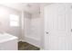 Bright bathroom with a modern vanity, sleek fixtures, and a shower-tub combo at 1305 W 23Rd St, Indianapolis, IN 46208