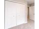 Bright bedroom featuring a large closet with white doors and neutral carpet at 1305 W 23Rd St, Indianapolis, IN 46208